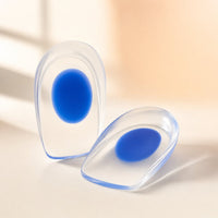 Pair of clear silicone gel heel cups with blue center pads